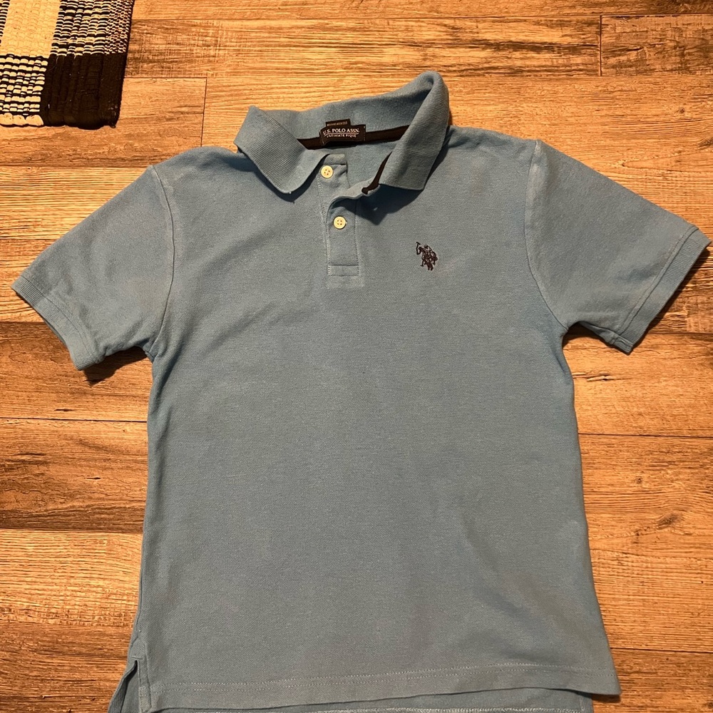 US Polo Association short sleeve shirt in color baby blue and in size Boys L